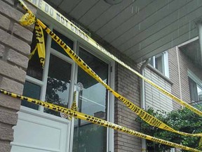 Police tape surrounds the entrance to 333 Home St. apartments Wednesday morning in Stratford. (SCOTT WISHART, The Beacon Herald)