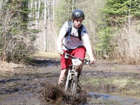 St. Thomas Aquinas’s Nathan Gagnon pedals through the mud puddles at the aptly named Mud n Mayhem mountain bike race in Thunder Bay on May 25-26. Gagnon is one of three cyclists from the St. Thomas Aquinas mountain bike team that made the trip along with coach Barry Kraynyk.