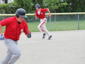 Paris pitcher Kris Kuik, right, runs for home in the Panthers final game of the season after being hit in by Kyle Boutilier. The Panthers lost to Assumption and ended the 2013 season in third place. MICHAEL PEELING/The Paris Star/QMI Agency