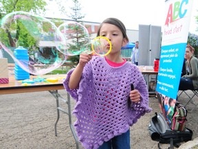 A girl blows bubbles at last year’s Bonnie Fest. FILE PHOTO