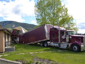 A semi-tractor trailer carrying a load of automotive batteries got tangled up with the Crowsnest Centre building late last night after attempting to turn around at the back. A 55-year-old High River man was charged with careless driving.