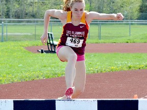 École secondaire catholique Thériault’s Renee Maisonneuve, seen here competing at the NEOAA Track & Field Championships on May 28, struck gold at the Ontario Federation of School Athletic Associations Track & Field Championship on Friday. And in the process she smashed the Canadian record set in 2012 by Julie-Anne Staehli, of F.E. Madill Secondary School in the 1,500 metre girls open steeplechase.