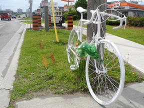A ghost bike marks the spot on Princess Street in Kingston where a 59-year-old cyclist was killed May 4. The death was the most serious of three collisions in the past five weeks that involved cyclists.                                
Elliot Ferguson The Whig-Standard
