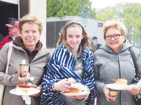 Mona Miller, Kaeley Simpson and Grace Loeppky enjoy some food during the Foundation Friday BBQ on Friday at the Portage District General Hospital. (File Photo)