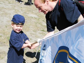 Nolan Proulx, three, and his dad, Shawn Partington, who belongs to a Steelworkers local in Brantford, attended a rally on Saturday outside the U.S. Steel plant in Nanticoke. The rally was held in support of members of United Steelworkers Local 8782, who have been locked out by the company after contract talks broke off. (DANIEL R. PEARCE Simcoe Reformer)