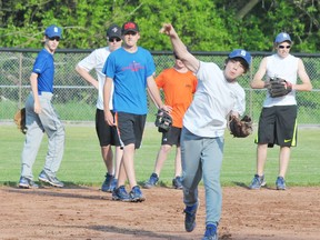 EDDIE CHAU Simcoe Reformer
Dameon Rutherford works on his throwing skills while his teammates from the Simcoe Bantam Minor Tier One Giants look on during a impromptu practice Wednesday at Memorial Park. The Giants are off to a strong start this season and hope to continue the trend.