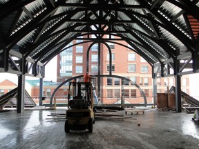 A worker is shown in the "Discovery Hall" portion of the Aquatarium in this photo provided by Aquatarium management last year. (FILE PHOTO)