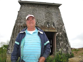 Donald MacDonald, who helped on his uncle’s fox ranch for decades, in front of the tower as it looks today.