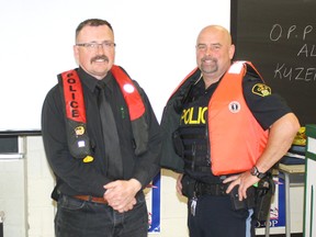 Dean Riggs and Sergeant Al Kuzenko of the Ontario Provincial Police display two styles of personal floation devices (PFD) to the students of Espanola Hogh School during last week’s presentation on boating safety and all-terrain vehicles. Photo by Amanda Johnson/ For the Mid-North Monitor