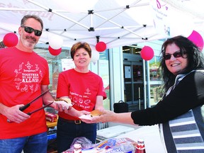 Canadian Tire franchise owner Jamie Senese with volunteers Kim Bartlett and Linda Pierce during the Jumpstart fundraiser barbecue on Saturday afternoon at Canadian Tire. Bartlett said around $350 was raised.
Photo by JORDAN ALLARD/THE STANDARD/QMI AGENCY
