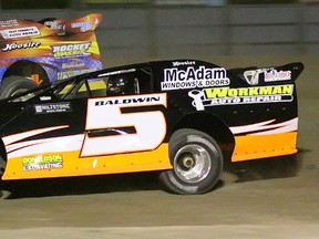 Trenton's Steve Baldwin battles with Trenton's Mat Vanderlinden en route to winning the Vanderlaan Building Supplies Late Model feature race Saturday at Brighton Speedway.