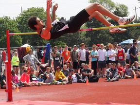 Trenton High Tigers' Leaugen Fray clears the bar en route to the senior men's high jump gold medal at last Thursday's COSSA track and field championships. Fray also won the long jump and triple jump.