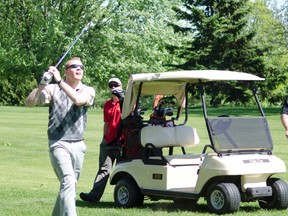 Korey MacKenize, a solider from Petawawa, reacts after hitting his golf ball during the Wounded Warriors Golf Tournament at Pine Ridge Golf & Country Club on Saturday. The tournament was expected to raise more than $2000 for Wounded Warriors.
