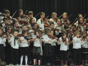 Cayley School fiddlers wrap up the concert May 28 with the big fiddle finale.