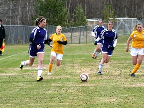 Stephanie Sparkman carries the ball up the field during a tournament in early May. Sparkman scored the winning penalty shot against Dryden on Wednesday, May 29 at the NorWOSSA championships.
