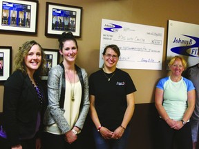A 24-hour spin fundraiser at Johnny B-Fitt lead to a $12,000 donation to the Kids For Cancer foundation. This was the fourth year that the event has been held. Pictured above event organizers present a cheque to the foundation. Photo by Aaron Taylor.