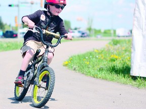 A boy completes Stephies’s Bike Tour. Photo by Aaron Taylor.