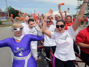 ‘Anytime Fitness Girl’ (Natalie Rozelle in civilian life), front, left, was among those riding in the annual Big Bike fundraiser for the Heart and Stroke Foundation of Canada Monday in Tillsonburg. The effort raised over $16,000 for education, advocacy and research. Jeff Tribe/Tillsonburg News