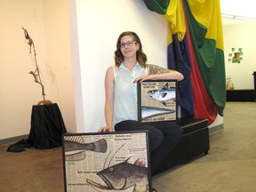 Kirsten Goruk/Daily Herald-Tribune
Local artist Larena Shakotko shows off two of the pieces that will be featured in her upcoming exhibit at the Centre for Creative Arts. The exhibit, titled “A look at the red list” involves paintings of endangered fish species combined with newspaper prints.