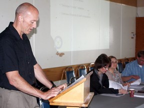 Timmins' manager community and development services Mark Jensen, left, reads information about the city’s new pre-consultation bylaw for those applying for construction and building permits. A public meeting with about a dozen developers, architects and contractors was held at Mountjoy Centennial Hall Thursday morning. Others speaking on the new bylaw were, from left, city secretary-treasurer Lisa Duval, manager of planning Cindy Welsh and manager of building Esa Saarela.