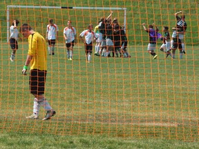 North Park Collegiate Trojans goalkeeper Cam Lumax is in disbelief after the St. David Celtics score and celebrate a last-second goal to win the the Central Western Ontario Secondary School Association boys AAA soccer championship at the John Wright Sports Complex Thursday. (DARRYL G. SMART/ The Expositor)