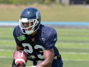 PORTER TURNS ON THE JETS
Running back Quinn Porter works on his technique at St. Thomas Aquinas High School in Oakville yesterday as the Argos continue to prepare for the CFL season. (Dave Thomas/Toronto Sun