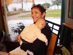 Subject in the photos is Wendi Belanger, in the first one she's holding her�grand-daughter, Malin Brunette