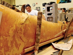 Algonquin birch bark canoe craftsman Chuck Commanda points out different parts of a canoe currently under construction in a Thousand Islands Secondary School art classroom. DARCY CHEEK The Recorder and Times