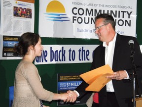 CEO of Copperfin Credit Union, Dennis Alvestad right, presents a certificate of participation to Lexie Rea left, for her involvement with the Youth in Philanthropy program at St. Thomas Aquinas. The year-end granting ceremony for the program took place at the high school on Wednesday, May 29. The group of 11 students gave out four, $700 cheques to four community organizations. 
GRACE PROTOPAPAS/Daily Miner and News