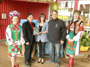 The Parkland Ukrainian Dancers Society are presented with a plaque commemorating their 30-year anniversary. - Photo Submitted