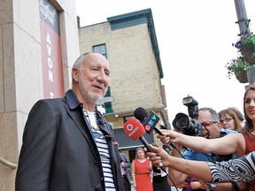 Rock icon Pete Townshend greets a crowd of fans and members of the media in front of the Avon Theatre in Stratford Thursday before the opening of the Stratford Festival's production of Tommy. (MIKE BEITZ, The Beacon Herald)