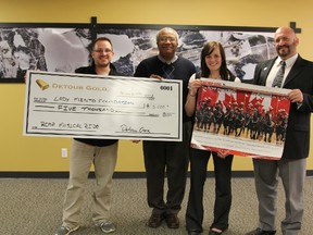 Pierre Noel, Communications and Community Relations Coordinator at Detour Gold presenting a $5,000 cheque to MICs CEO, Bruce Peterkin, Veronique Filion, and Mayor Peter Politis for the RCMP Musical Ride.