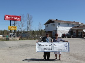 Laura Labelle, Board of Trade Vice President, presenting Noel Tamakuwla, owner of the Thriftlodge with his Member of the Month banner for May.