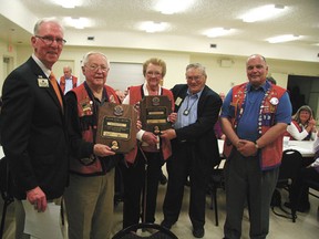 Bob and Agnes McDonald (centre) accepted Melvin Jones Fellowships from former director of the International Association of Lions Clubs Bill Webber, and from Devon Lions members Dan Claypool and outgoing president Gordon Groat.