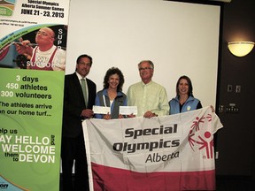 The mayors of Parkland County and the city of Spruce Grove, Rod Shaigec (left) and Stuart Houston both visited Devon on Friday, May 24 to deliver donations in the amount of $5,000 each for this June’s Alberta Summer Special Olympics, to be held in Devon. Mayor Anita Fisher (second from left) and Devon’s Special Olympics Committee chair Michelle Deering accepted the cheques.