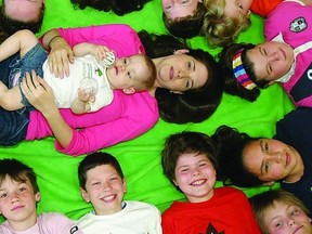 Genevieve Villeneuve and her daughter Abigale, who just turned one, has been making monthly visits with students in Amy Cuthbert-Brown’s Grade 6 class at John XXIII Catholic School since September as part of the Roots of Empathy program.        ROB MOOY - KINGSTON THIS WEEK