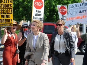 About 50 protesters greeted Premier Kathleen Wynne when she arrived at the opening of the Goodwill One Tomato garden in Sarnia around 10 a.m. Friday, May 31. Protesters chanted "Hey, hey Liberals, you’re fired, you’re fired,” and “Hey Wynne, you’re not listening.” BLAIR TATE/FOR THE OBSERVER/QMI AGENCY