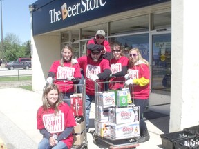 Pictured is store employee and event organizer Andrea Little who took a quick break from sorting bottles with her volunteers to pose for a quick photo.