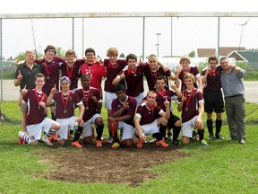 The École secondaire catholique Thériault Flammes soccer team have earned a berth into the OFSAA final with a 2-1 triumph over the TDSS Saints. The team poses for a photo following the win.