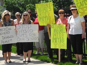 A group of local physiotherapists and senior citizens gathered outside Brant MPP and Speaker of the Ontario Legislature Dave Levac's office on Nelson Street on Friday. They were there to demonstrate against changes to the model for physiotherapy services in long-term care centres. Although provincial government officials say the changes will expand access to physiotherapy and increase the number of people who receive it, critics worry the changes will mean less treatment for seniors. (VINCENT BALL Brantford Expositor)