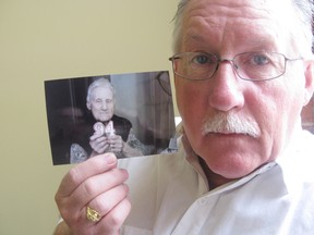 Ken Allan holds up a photo of his mother Ella taken on her 94th birthday.
Paul Schliesmann/The Whig-Standard