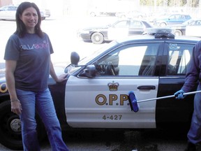 South Porcupine OPP Caretaker Donna Krysko poses with Kevin Ford, OPP cruiser detailer extraordinaire.