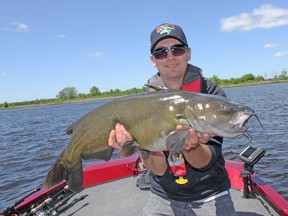 Matthew Heayn with his biggest channel cat to date, an 18-pounder he caught in the Bay of Quinte. (Ashley Rae/For The Whig-Standard)