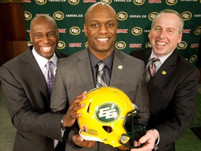 From left, Edmonton Eskimos’ head coach Kavis Reed, general manager Ed Hervey, and president and CEO Len Rhodes pose for a photo following a press conference where Hervey was announced as the team’s new GM on Dec. 10, 2012.
David Bloom/Edmonton Sun