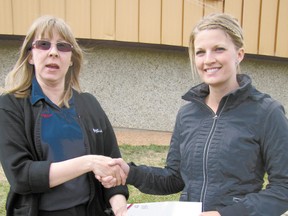 Loreen Airey, left, Mayerthorpe Co-op food manager, presents a $2,000 cheque from the Co-op to Natasha Prokipchuk, Elmer Elson Elementary School parents fundraising committee representative, on Thursday, May 23.