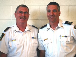 Outgoing St. Thomas police Chief Bill Lynch, left, stands with incoming Chief Darryl Pinnell Friday afternoon at Lynch's retirement party at the St. Thomas Seniors Centre. Lynch is retiring after 35 years with the St. Thomas force.