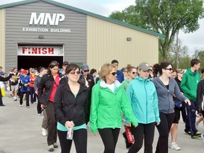 Walkers leave the starting ground during the Central Plains Challenge Walk held at the MNP Building on Island Park, Saturday. The walk and run raised roughly $70,000 for Central Plains Cancer Care Services. (ROBIN DUDGEON/PORTAGE DAILY GRAPHIC/QMI AGENCY)