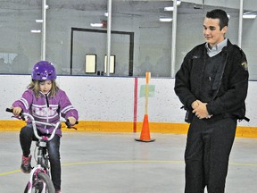 Colten Hall, making his first public appearance as an RCMP auxiliary officer, helped out May 8 during the Safety Bike Rodeo at the Vulcan District Arena.