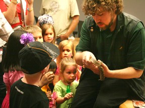 Today file photo
Showing off one of the museum’s many critters, Taylor Chadwick with the Royal Alberta Museum takes a moment during last year’s Environment Week activities at the Oilsands Discovery Centre to teach local children about the hog-nosed snake.