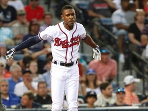 Atlanta Braves batter B.J. Upton throws his bat as he reacts to striking out to end the fourth inning during their MLB inter-league baseball game against the Toronto Blue Jays in Atlanta, Georgia May 29, 2013. (REUTERS/Tami Chappell)